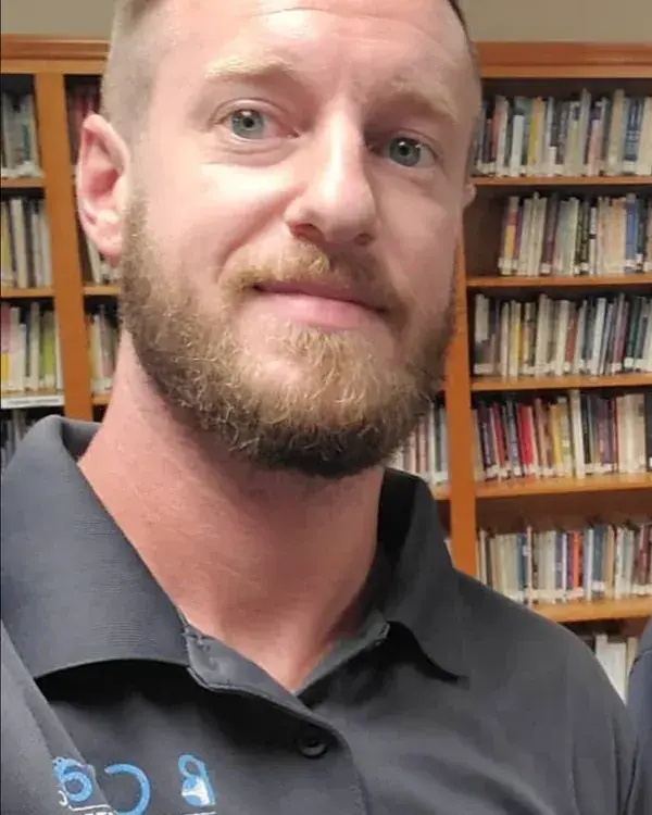 Bryan Wilson, owner of B Clean Carpet & Upholstery, in his company polo